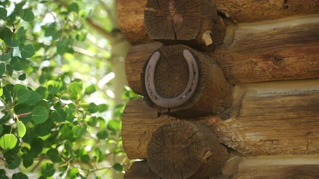 Cu Close up of horseshoe on log house