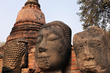 Fototapeta na wymiar Ruins of Buddha statues of Ratchaburana temple in the Ayutthaya Historical Park, Ayutthaya, Thailand