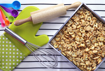 Cracker font, Cookie font alphabet in Baking tray, Rolling pin. Top view.