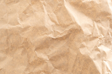 Crumpled brown paper texture perfect for background structure. Packaging material with rough wrinkles. The grunge textured surface is a vintage backdrop.