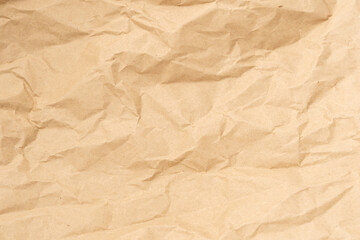Crumpled brown paper texture perfect for background structure. Packaging material with rough wrinkles. The grunge textured surface is a vintage backdrop.