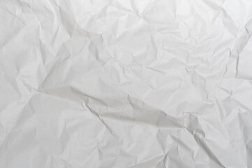 Obraz premium Crumpled white paper texture perfect for background structure. Packaging material with rough wrinkles. The grunge textured surface is a vintage backdrop.