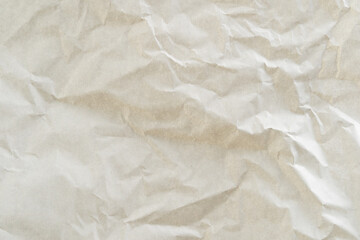 Crumpled white paper texture perfect for background structure. Packaging material with rough wrinkles. The grunge textured surface is a vintage backdrop.