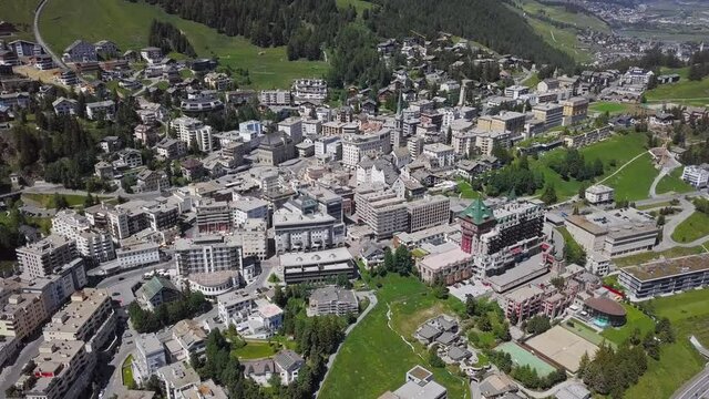 Aerial panorama of St. Moritz (Sankt Moritz), high Alpine resort town in the Engadine, Graubunden, Switzerland. 2.5x speeded up from 24 fps.