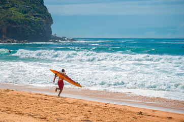 lifeguard run into the water