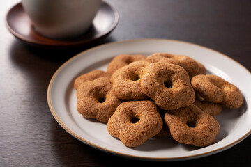 Japanese baked goods set against a wooden background. Sobaboro