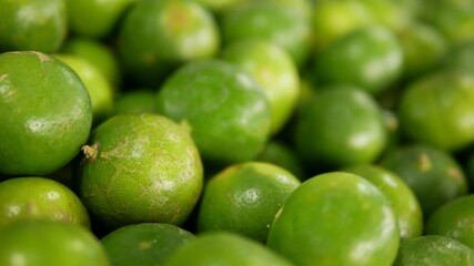Background from fresh lime, blurry lime in market, Nature food