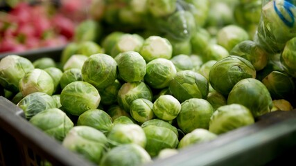 Fresh green Brussels sprouts in market.