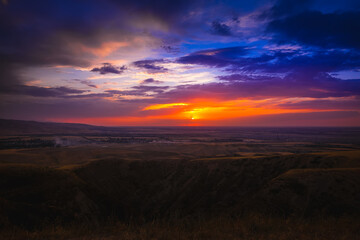 Naklejka na ściany i meble Sunset panorama from the mountain