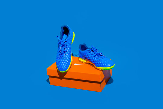 Kiev, Ukraine - January 16, 2021: Nike Sports Shoes For Men. Blue Sneakers On An Blue Background. There Is An Empty Box Next To It