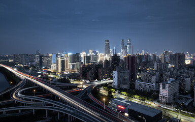 Fototapeta na wymiar The night scene of Honggutan financial district and the developed urban traffic viaduct