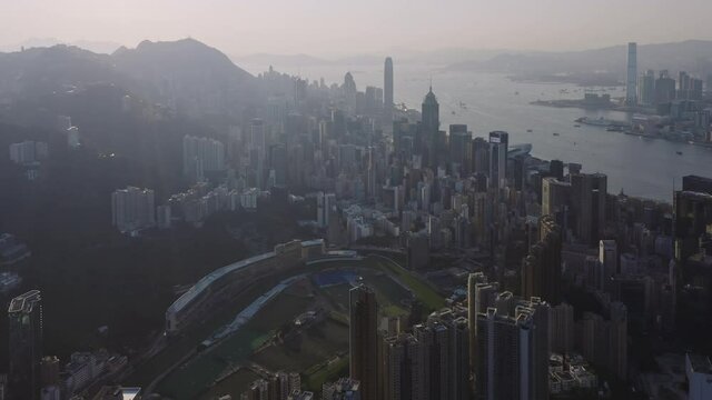 Aerial view of Hong Kong island downtown center and harbor at sunset