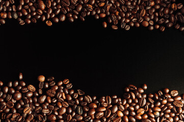 coffee beans flat lay on a wooden table on a black background. low key. Copy space. Mockup
