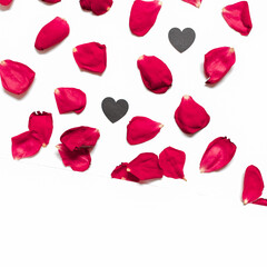 Rose petals and heart-shaped confetti are on a white background.  Floral layout for valentine's day, birthday, wedding invitation. Flat lay. Top view. Copy space.