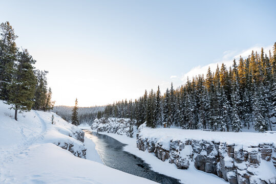 Beautiful Miles Canyon along the Yukon River outside of Whitehorse in northern Canada, Yukon Territory. Taken in winter time with bright day, snowy landscape and boreal forest. 