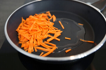 Chopped fresh carrots in a pan