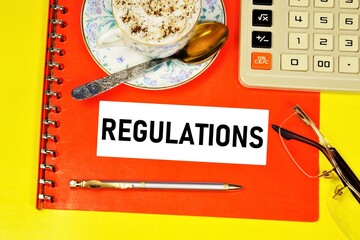 Regulations. A text inscription in a folder with documents is a set of rules governing the...