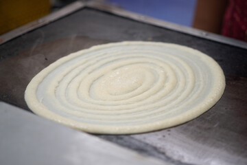 Fototapeta na wymiar Making of crepes pancakes