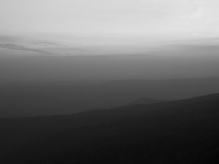 Dramatic sunset gradient shade mountain landscape of Phu Kradueng National park. Thailand. Black and white