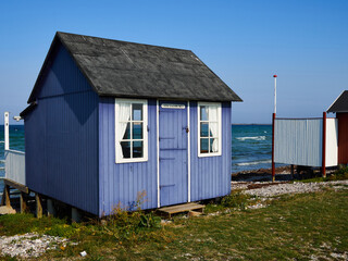 Fototapeta na wymiar Beautiful cute little wooden beach huts summer houses, painted in lively colors, Aero Island, South Funen, Denmark
