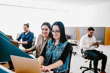 Group of Mexican business people working together in office in Mexico or Latin America city