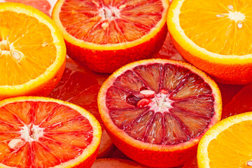 Different kinds of oranges and grapefruit slices background