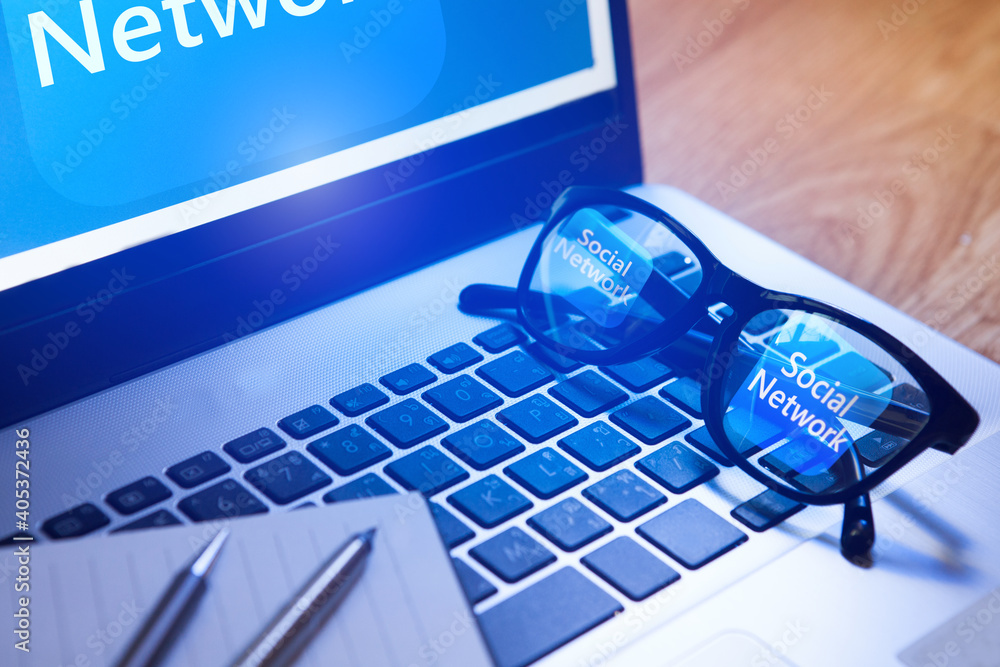 Poster laptop with application icon with reflection in glasses