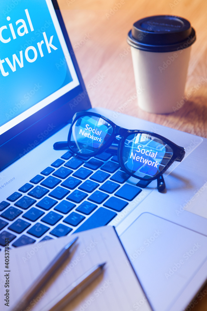 Poster laptop with application icon with reflection in glasses