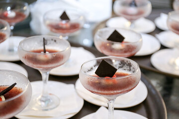 Strawberry, redberry, or cherry jelly desserts on a glass and plate. Wedding event dietary sweetness jelly dessert