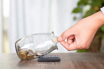 Put euro coins into a glass bottle