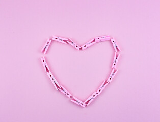 heart shape made of pink clothespins