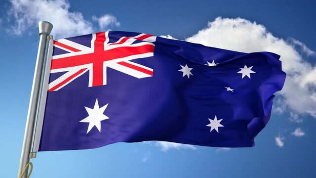 A closeup animation of the waving flag of Australia, flag fluttering in the wind, under the blue sky and white clouds