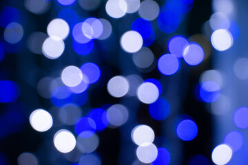 Abstract blue bokeh texture on black background