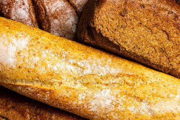 Fresh crispy bread, baguette on the counter in the bakery. Food Background