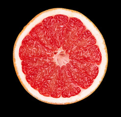 grapefruit lies on a black background