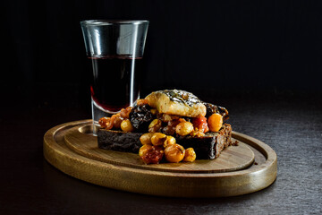 Kashubian herring.  Herring in tomato sauce with prunes, raisins on black bread.