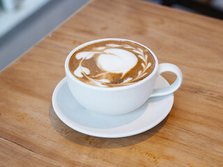 Obraz premium cup of coffee with latte art milk foam surface