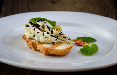 Spread of fish and cheese on a toast