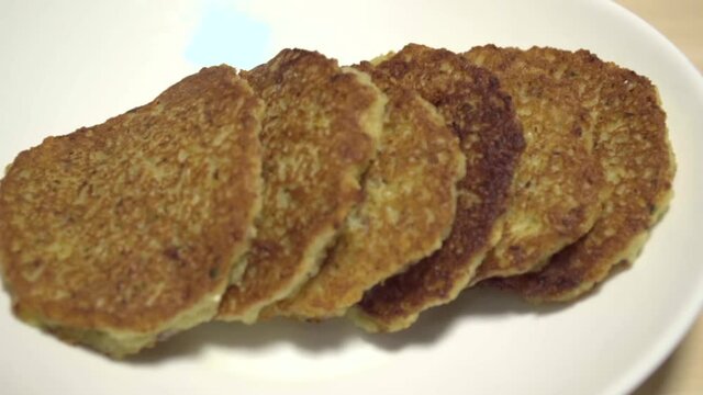 Ready potato pancakes are on the plate. Close-up. Dranik, Russian traditional food. Side view