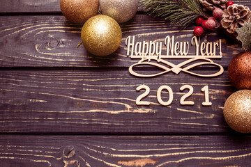 Happy new year 2021 on wooden brown background