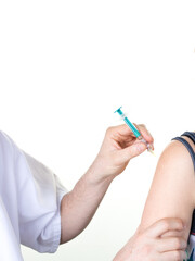 Hands of doctor vaccinating young woman in clinic injection to female patient