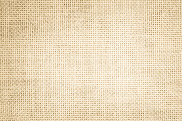 Jute hessian sackcloth canvas woven texture pattern background in light beige cream brown color blank empty