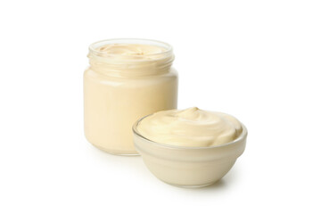 Obraz na płótnie Canvas Jar and bowl with mayonnaise isolated on white background