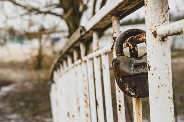 Old padlock. Metal, rusty, with peeling paint. Beautiful texture.
