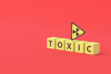 Cubes with word toxic near sign of radiation hazard on red background. Copy space. 3d rendering