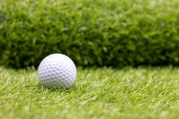 Golf ball is on green grass
