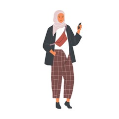 Modern Muslim woman wearing trendy casual clothes and hijab using phone. Fashion Arab female character in trousers and traditional headdress. Flat vector illustration isolated on white background