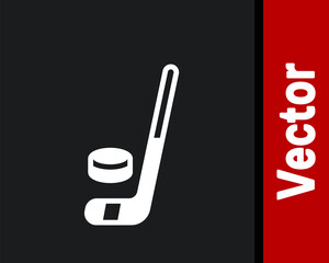 White Ice hockey stick and puck icon isolated on black background. Vector.