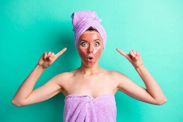Portrait of attractive scared person indicate fingers head open mouth purple towel isolated on teal...