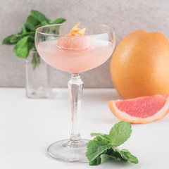 Glass with ice cream and pink champagne. Delicious drinks concept.